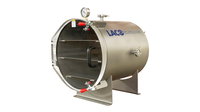 Cylindrical stainless steel vacuum chamber with three shelves and acrylic door, angled view